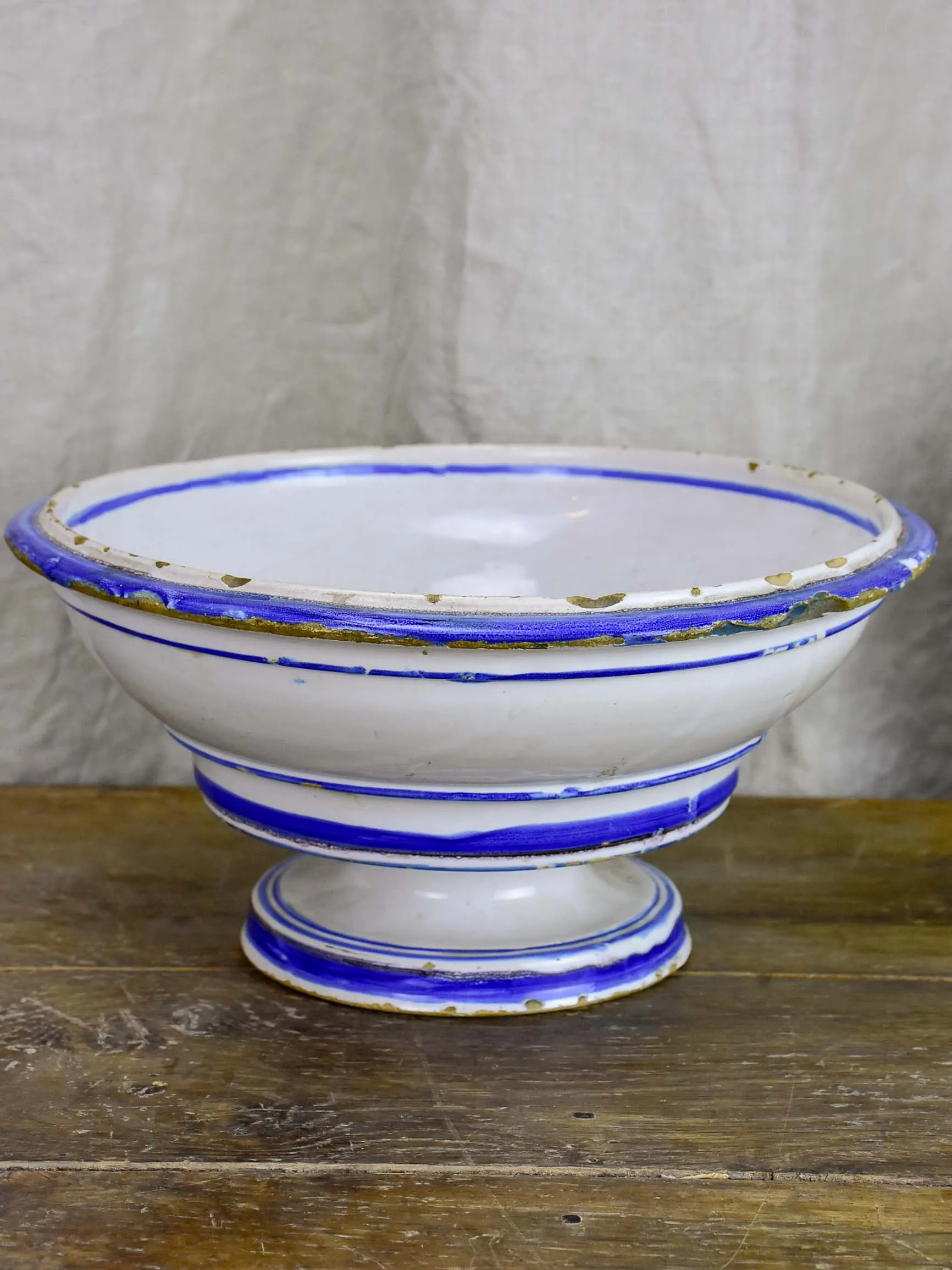 Antique fruit bowl with blue and white glaze