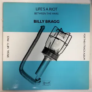 BRAGG, BILLY = LIFE’S A RIOT/BETWEEN THE WARS (CDN 1985) (USED)