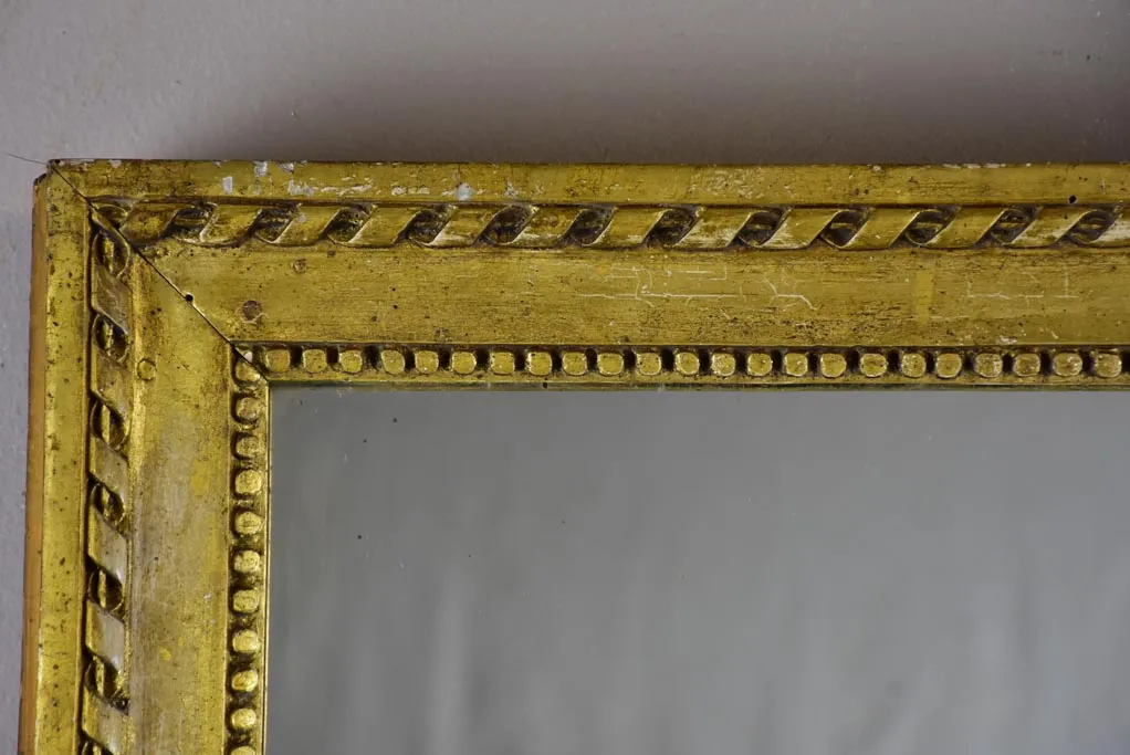 Early 19th Century French mirror with fatigued gold frame