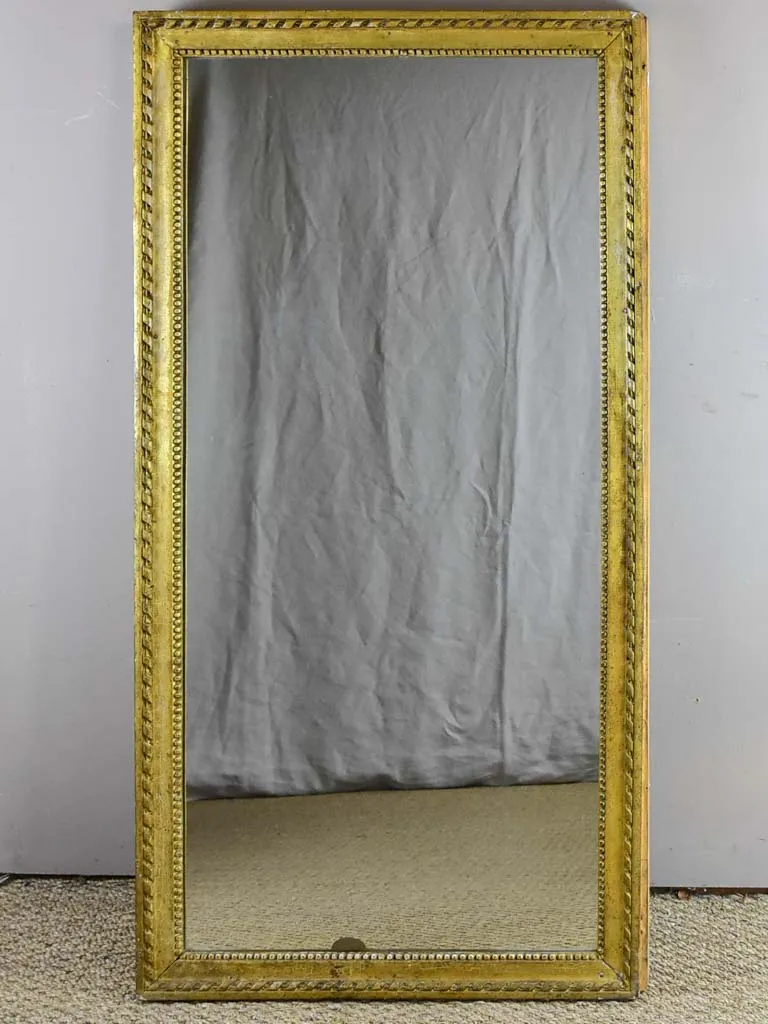 Early 19th Century French mirror with fatigued gold frame