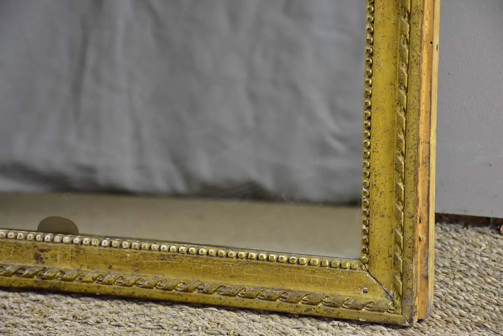 Early 19th Century French mirror with fatigued gold frame